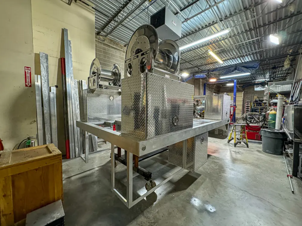 Diamond-plate body and step detail in production, photo 148 of 303.